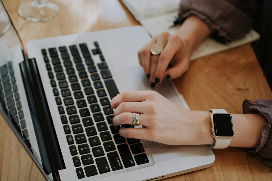 Woman typing on computer