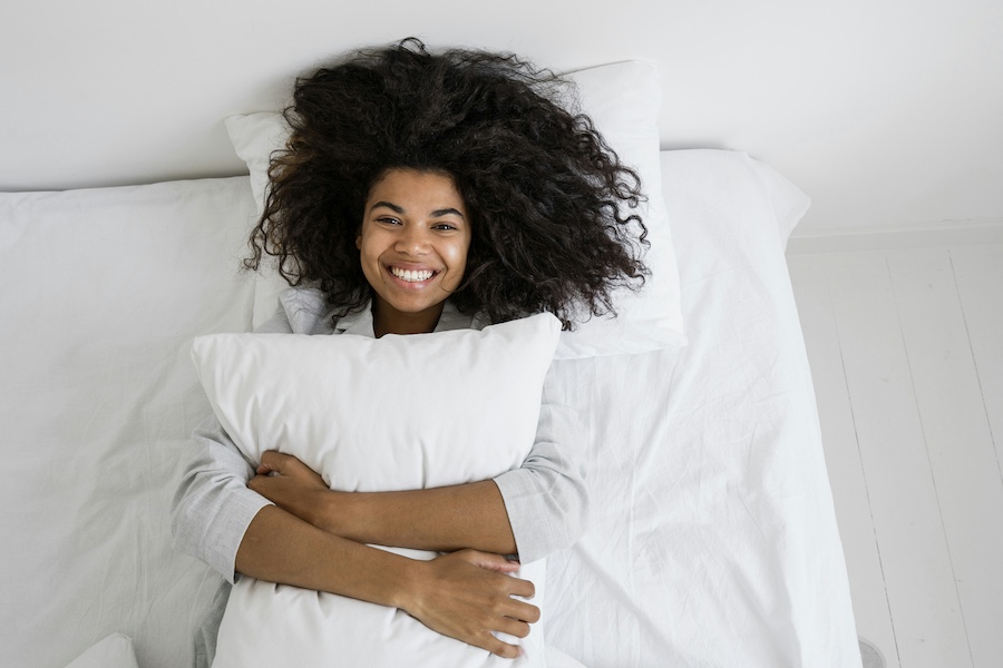 woman laying on bed